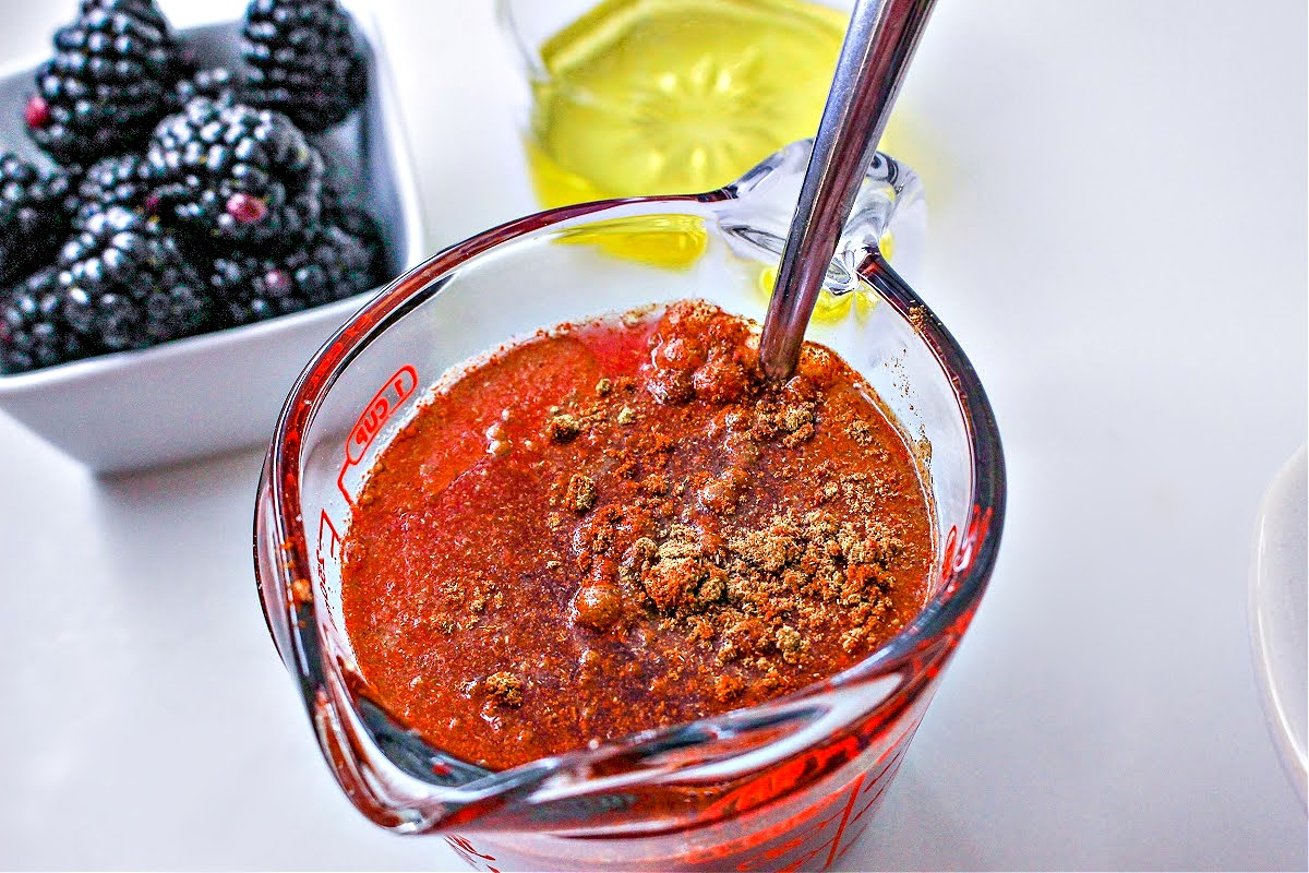Making the blackberry sauce in a glass measuring cup