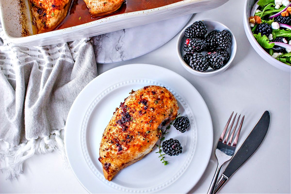 A white plate with Keto Blackberry Chicken