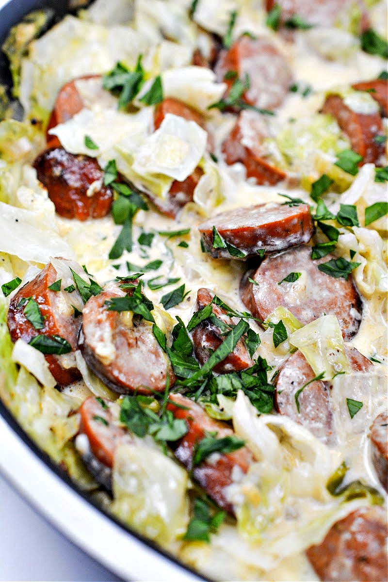 A skillet of cabbage and sausage alfredo