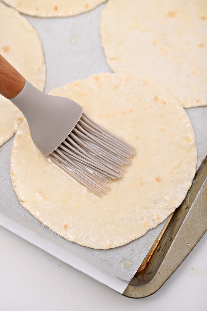 Brushing keto tortillas with butter