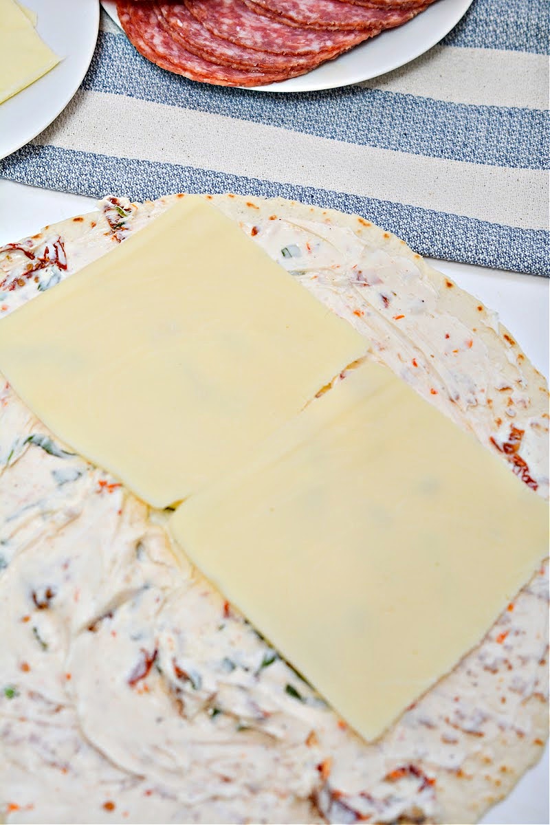 Adding cheese to Keto Italian Pinwheels