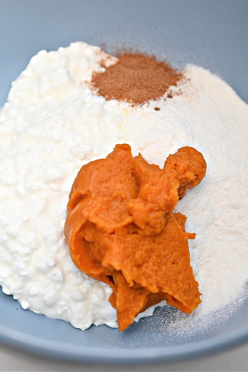 Mixing Pudding powder, pumpkin puree, spices, and cottage cheese together