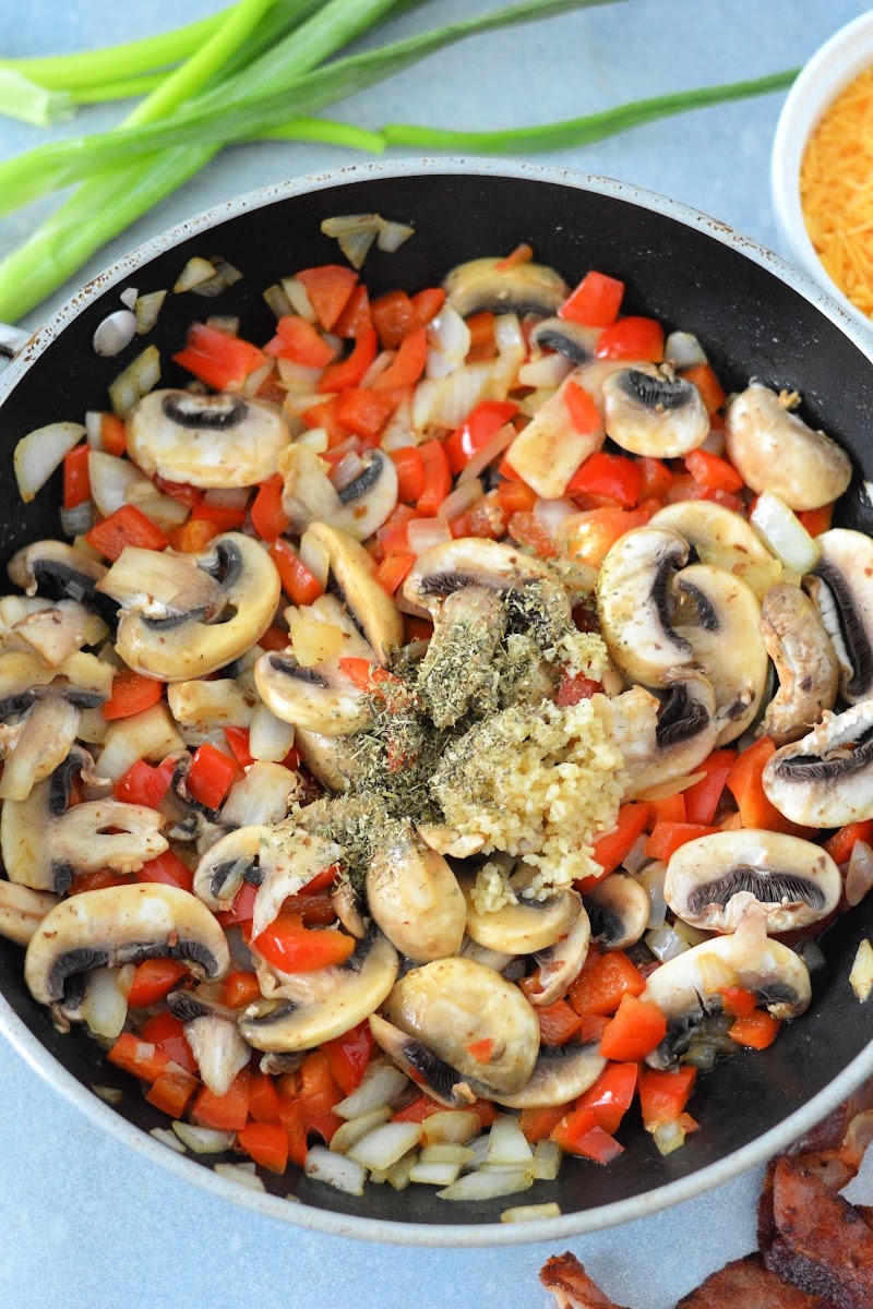 Sauteeing the veggies and spices in a skillet
