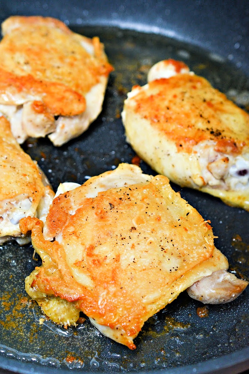 Chicken thighs in a skillet
