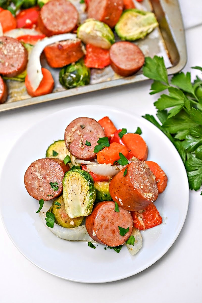 Low Carb Honey Garlic Sausage and Veggies on a white plate.