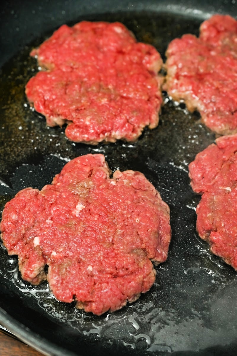 Grilling burgers in a skillet