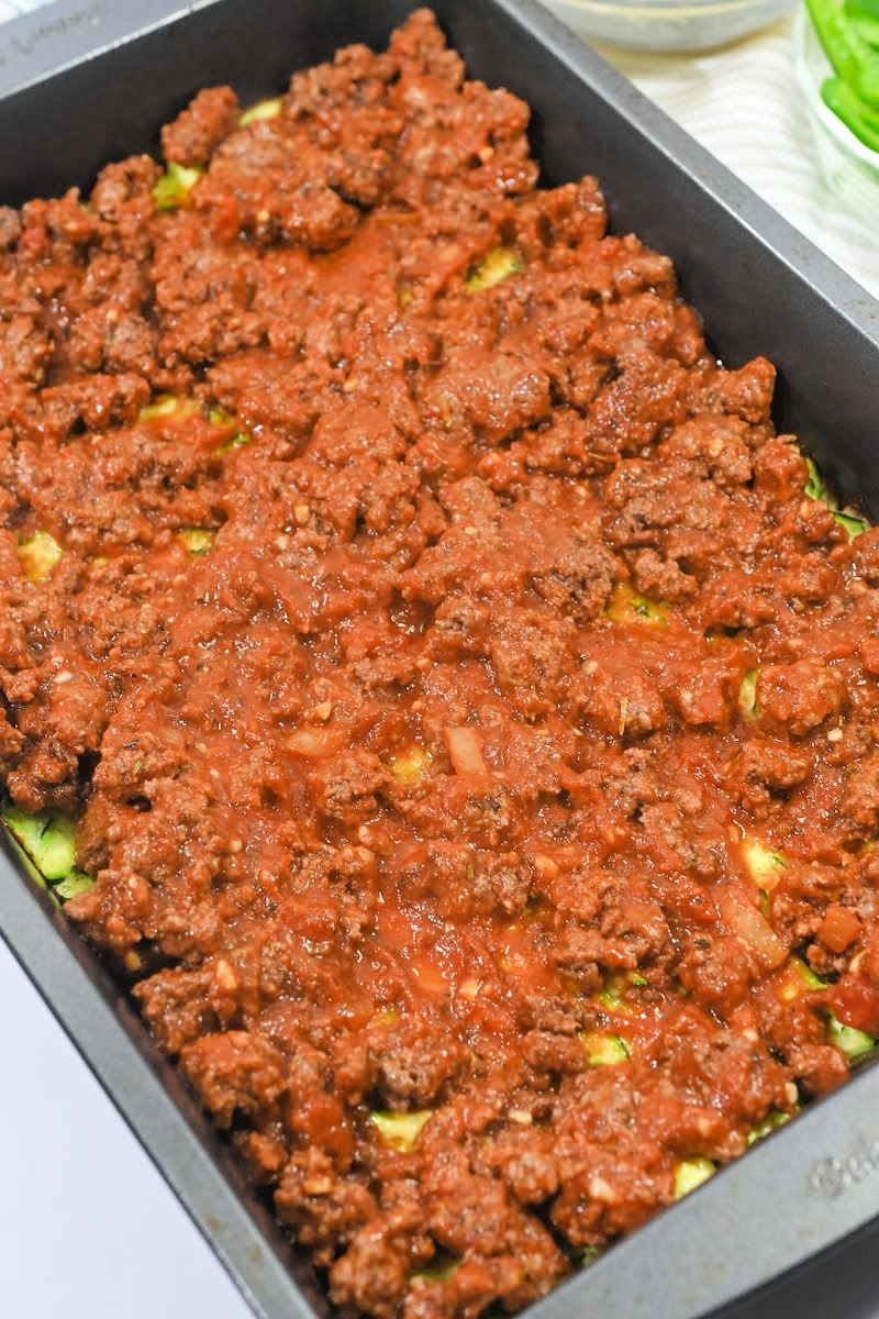 Adding ground beef mixture to the casserole