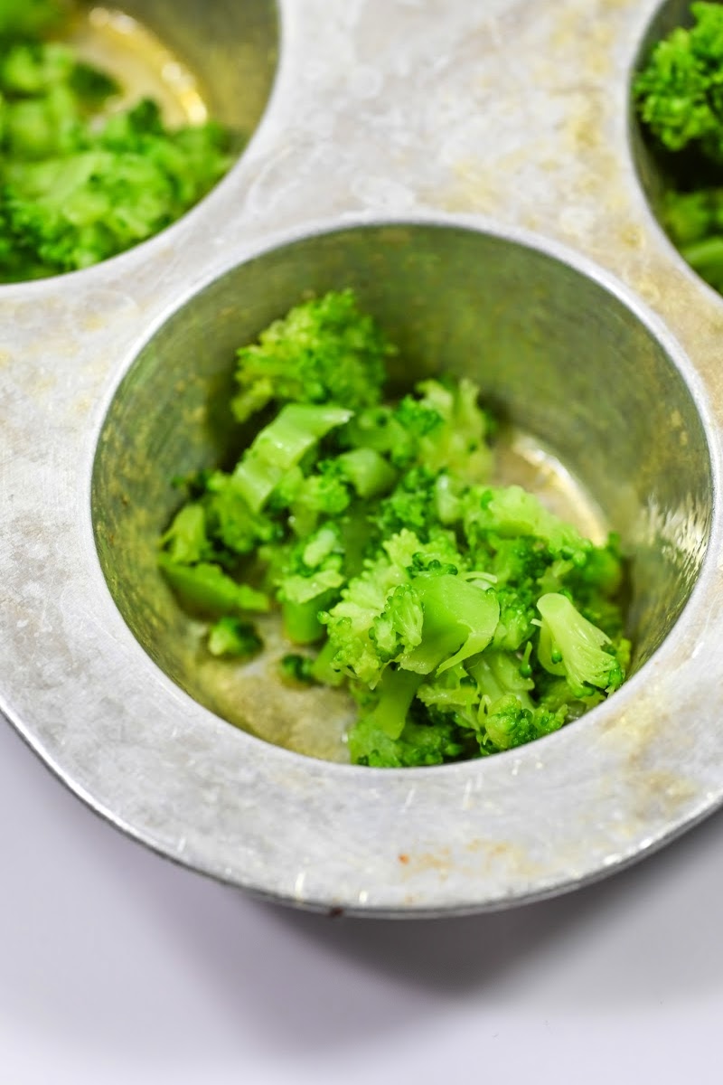 Putting broccoli in a muffin tin