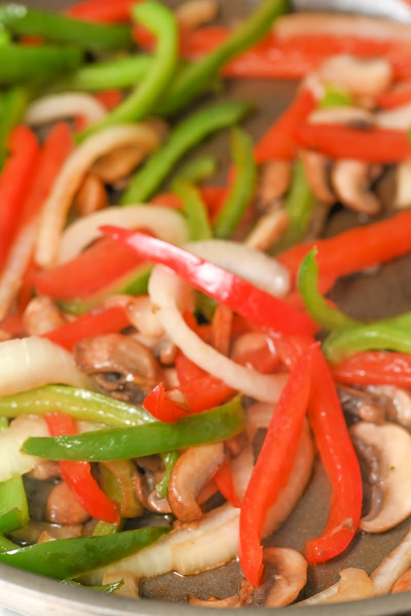Sauteeing peppers, onions, and mushrooms