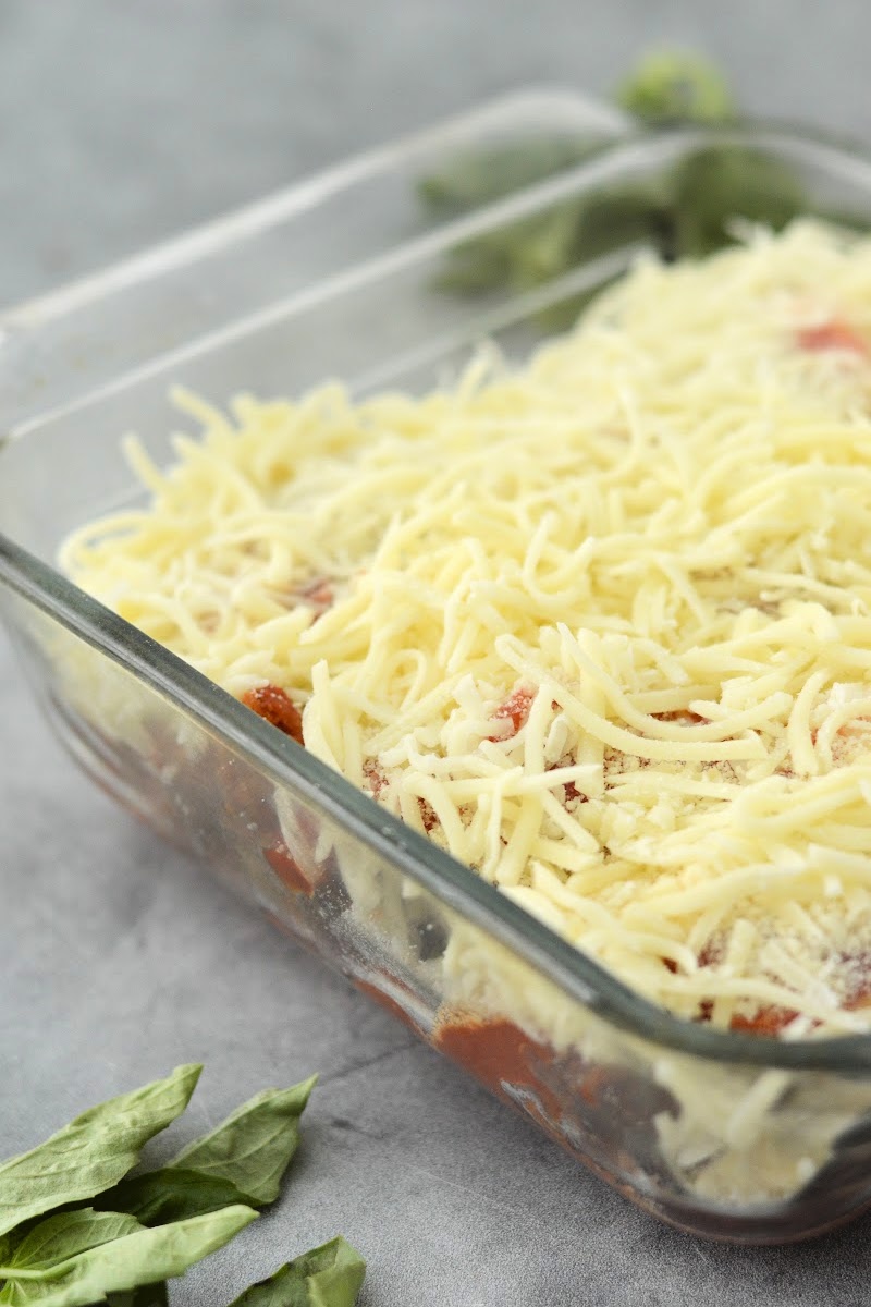 Shredded cheese on the unbaked casserole