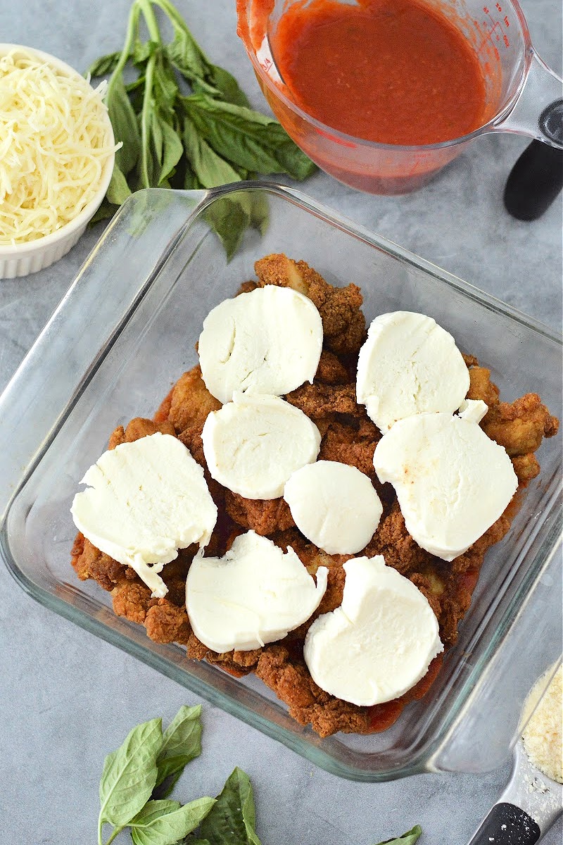 Adding fresh mozzarella cheese on top