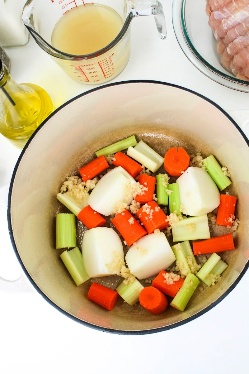 Adding vegetables to the dutch oven