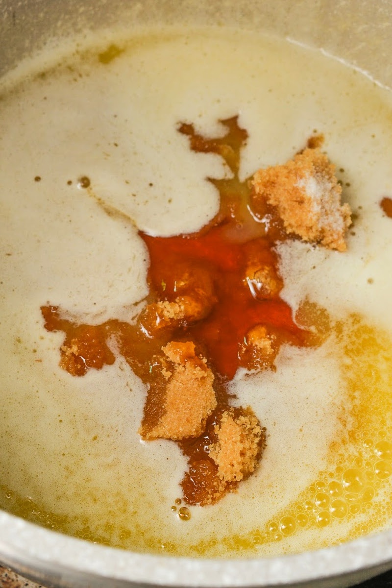 Adding sugar to the melted butter