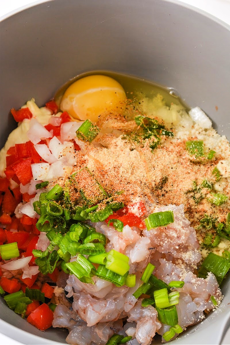 Mixing patty ingredients in a bowl