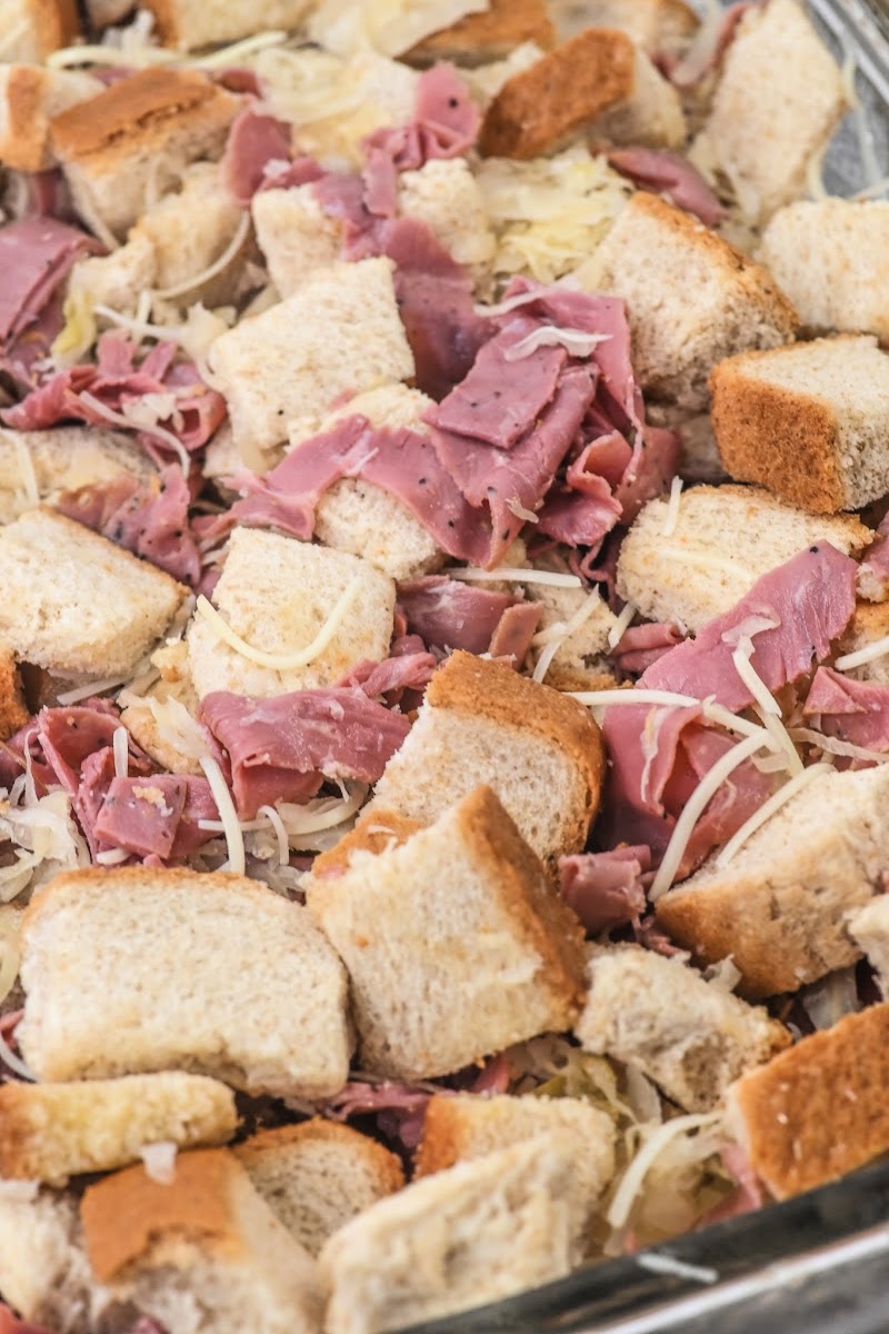 Adding corned beef to the bread