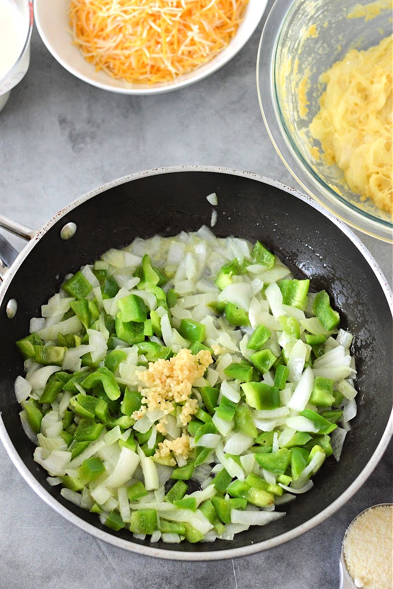 Mixing peppers and garlic
