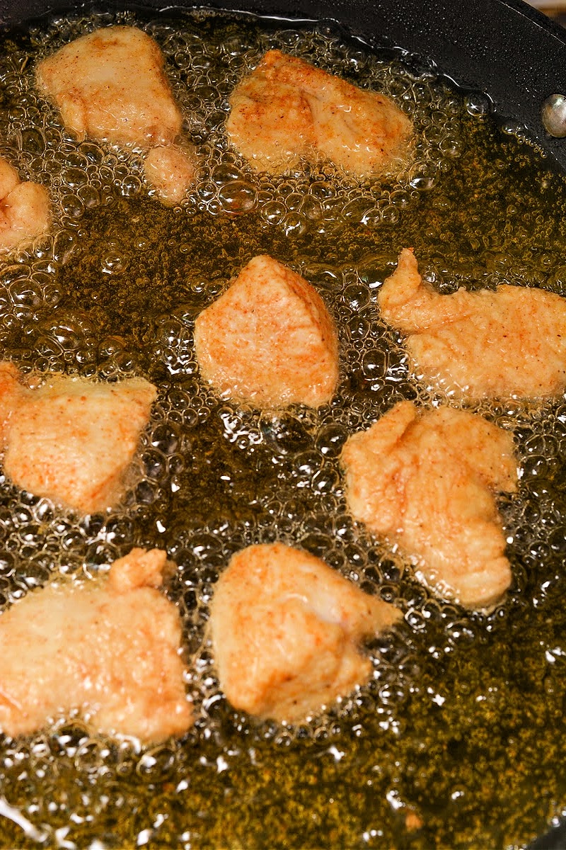 Frying the chicken pieces