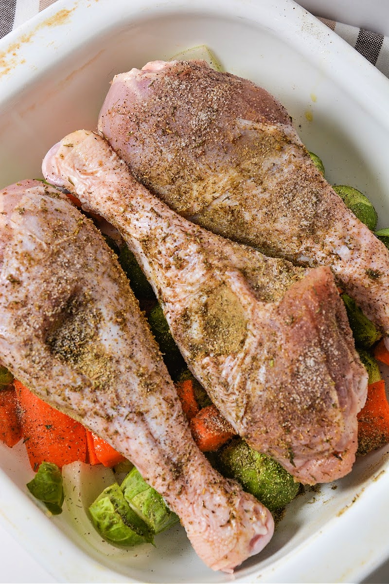 Adding spices to raw turkey legs