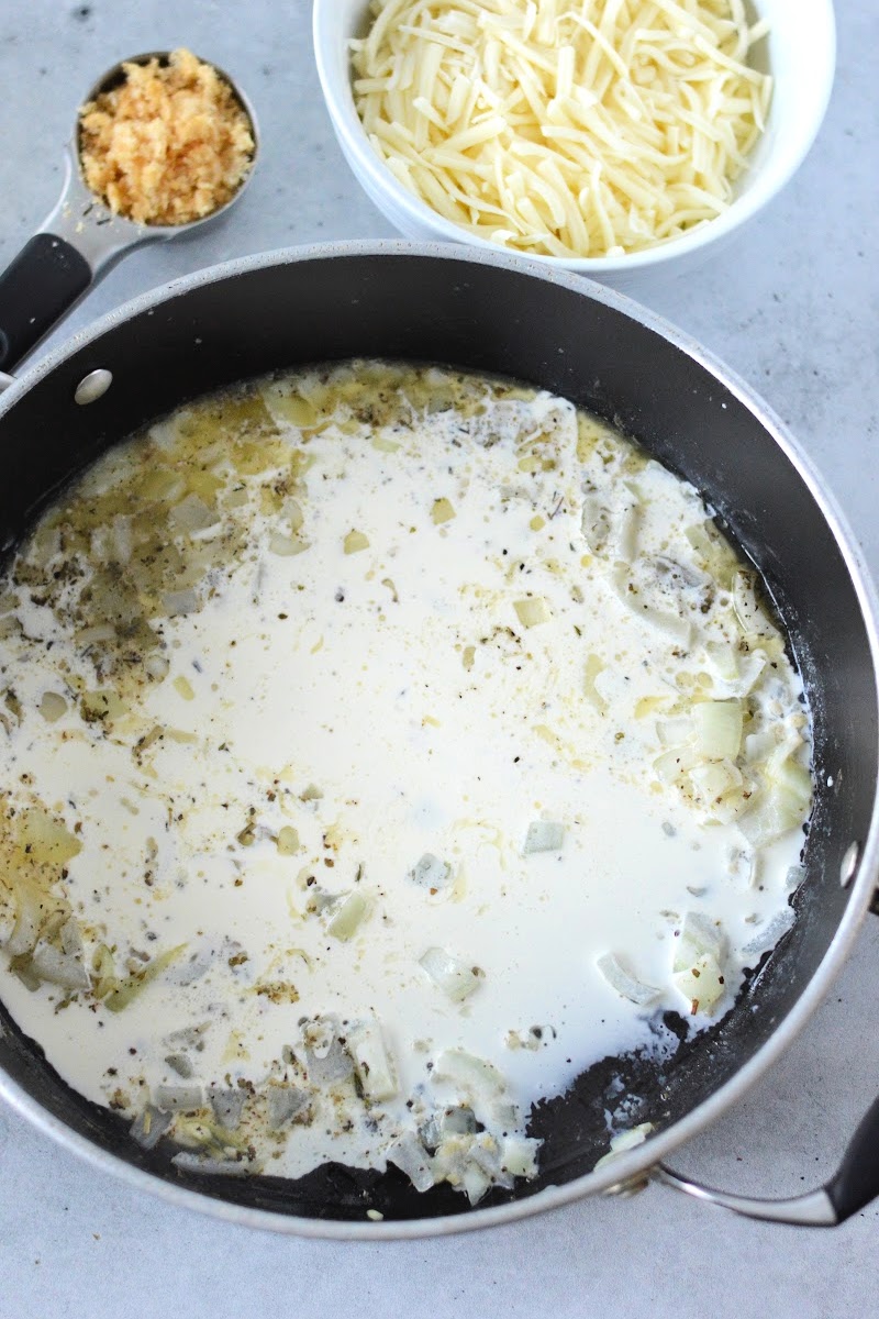 Adding heavy cream to the skillet