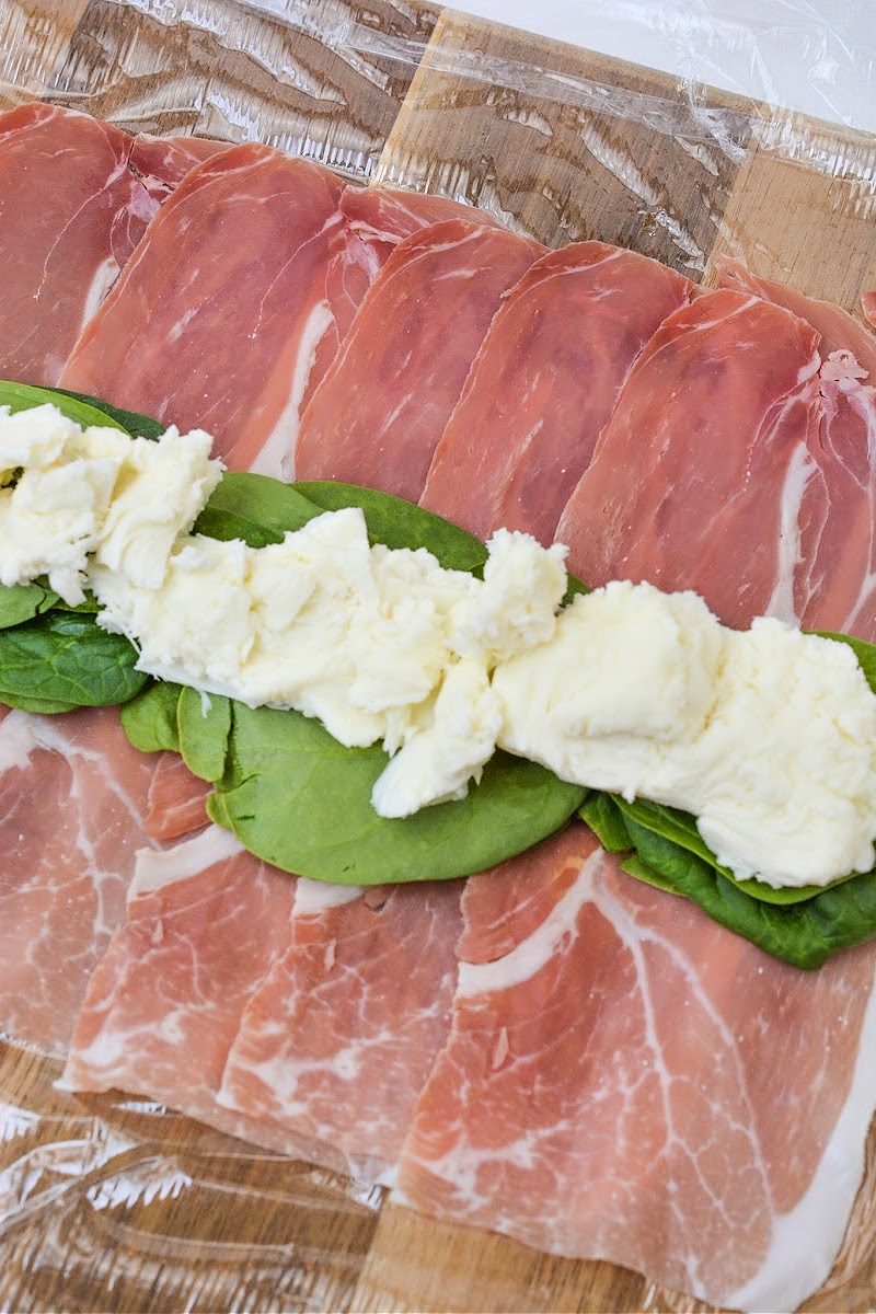 Adding fresh mozzarella
