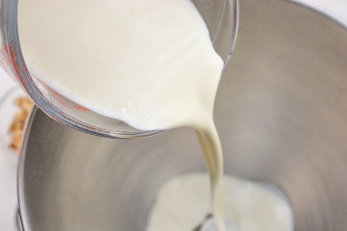 Adding heavy whipping cream to a bowl