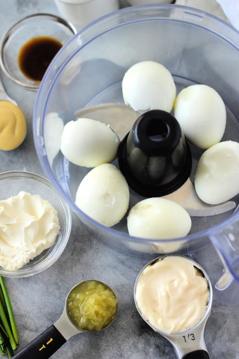 Placing hardboiled eggs in the food processor