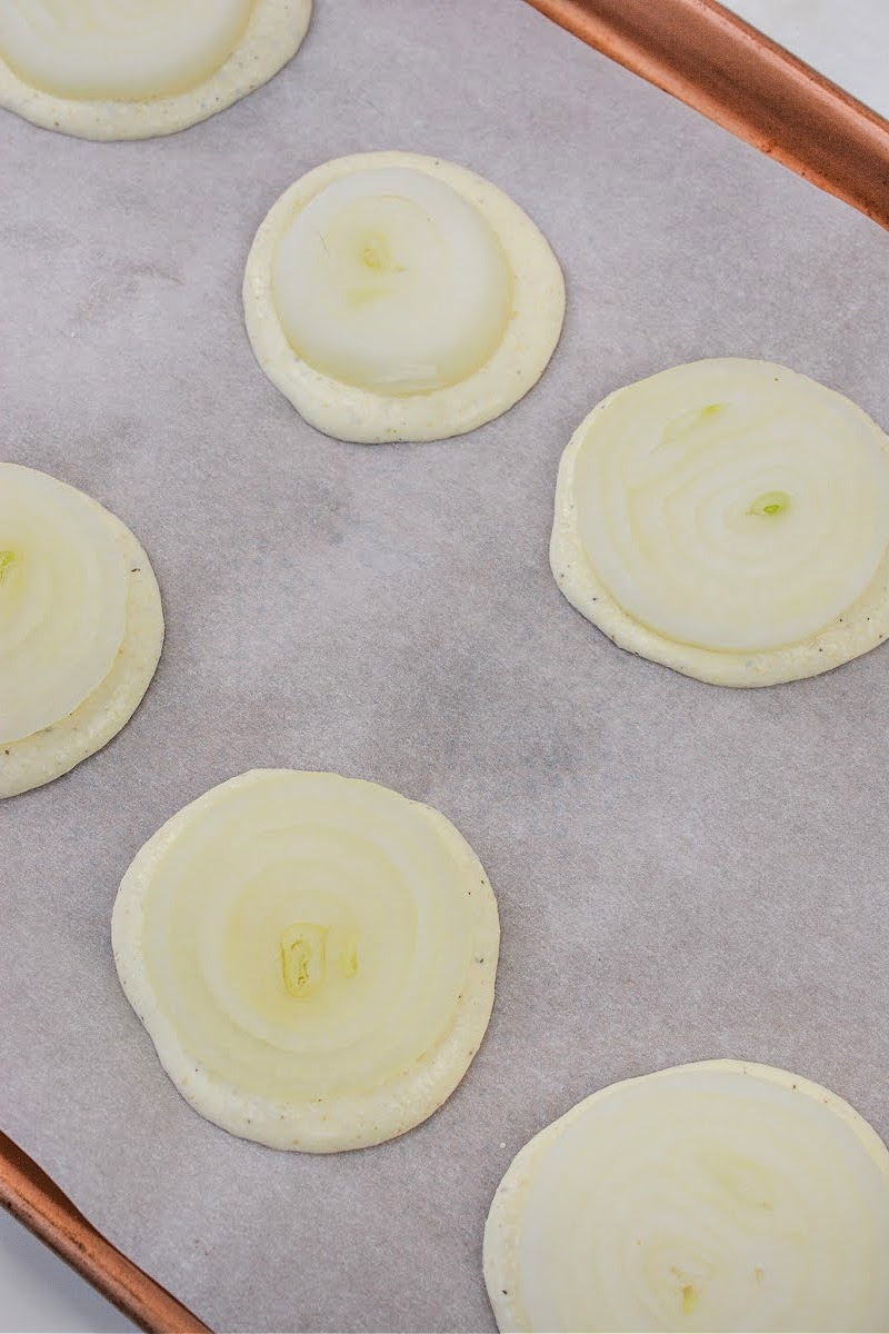 Placing onions on top of raw batter