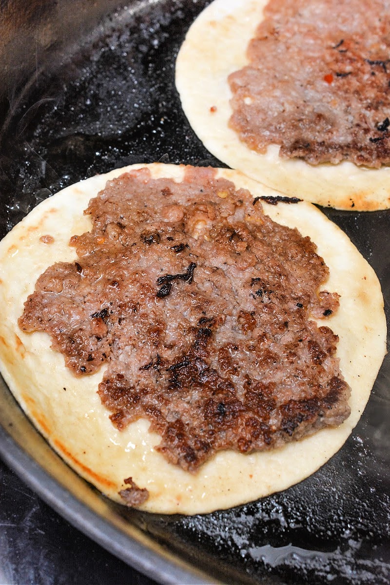 Frying sausage on the tortilla