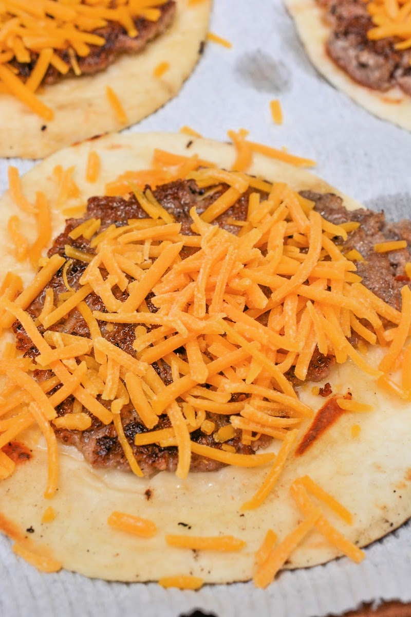 Adding cheese to the sausage