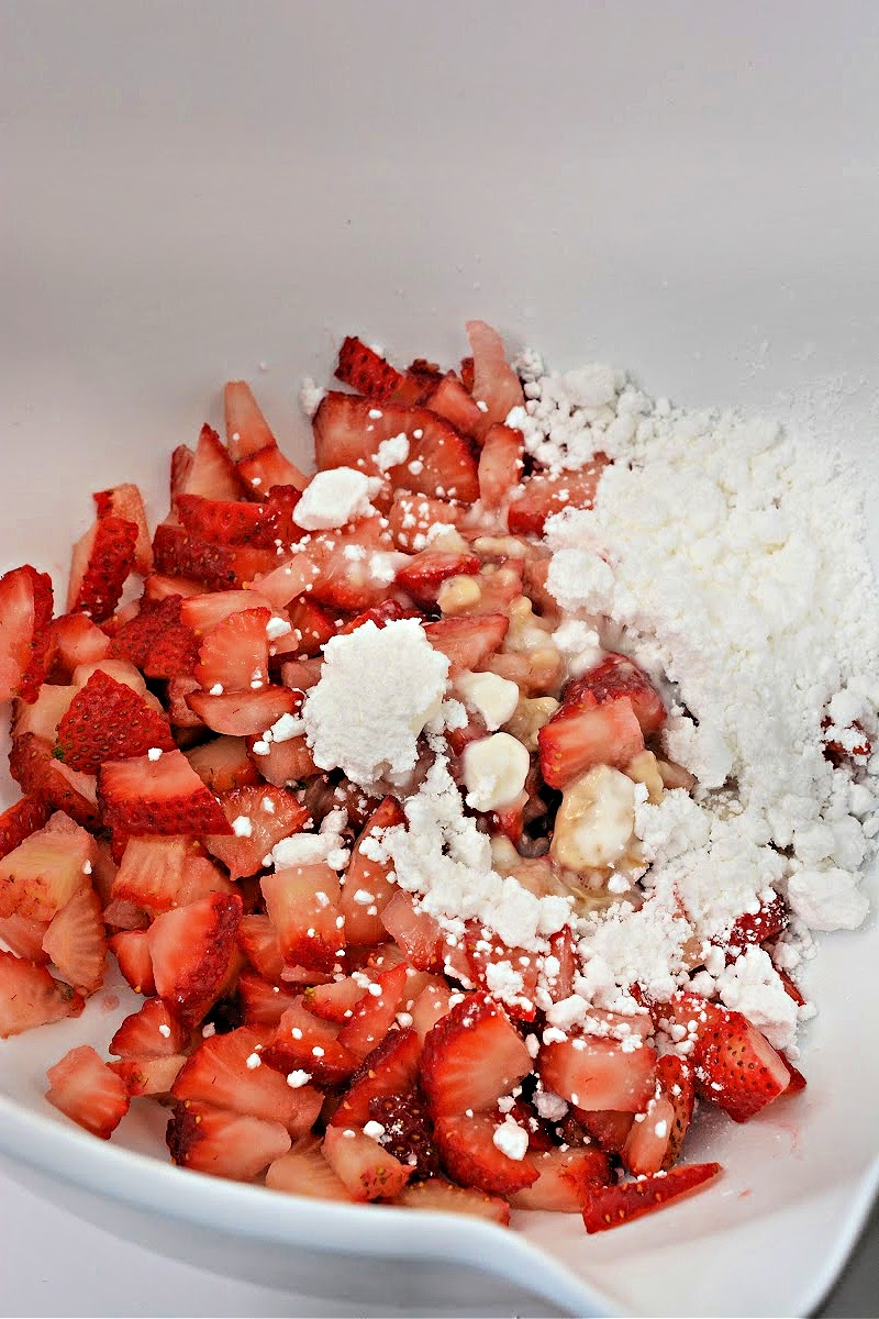 Mixing strawberries with powdered sugar substitute
