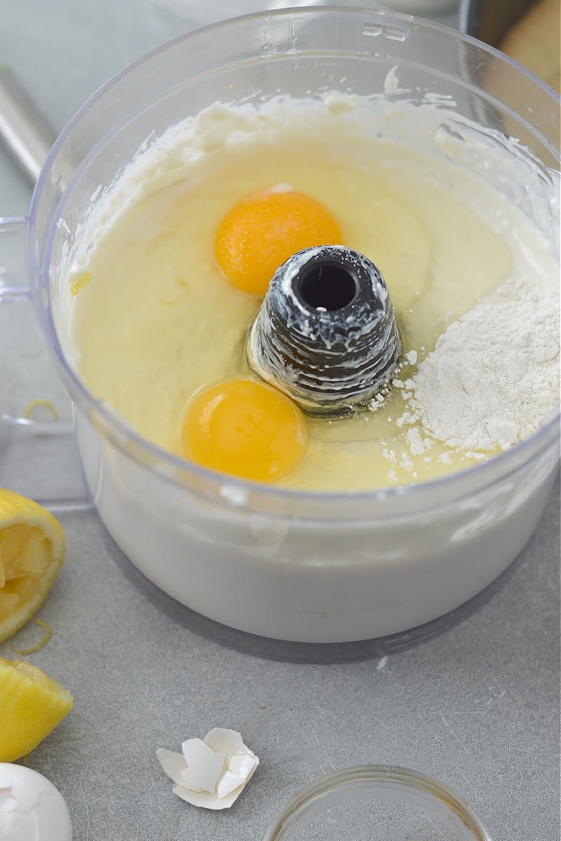 Adding eggs to the cheesecake filling