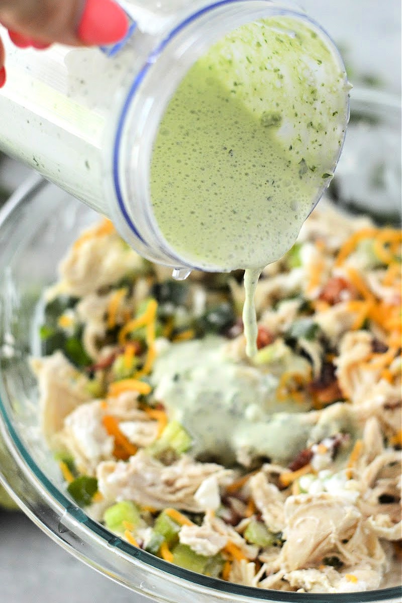 Pouring dressing on the salad