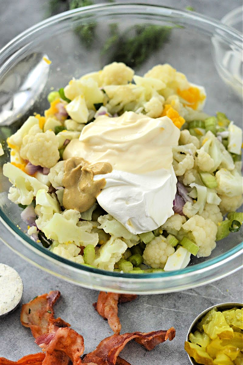 Adding mayo and mustard