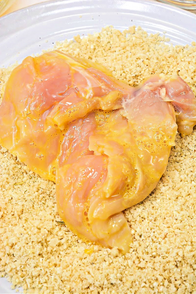 Adding breading to the chicken