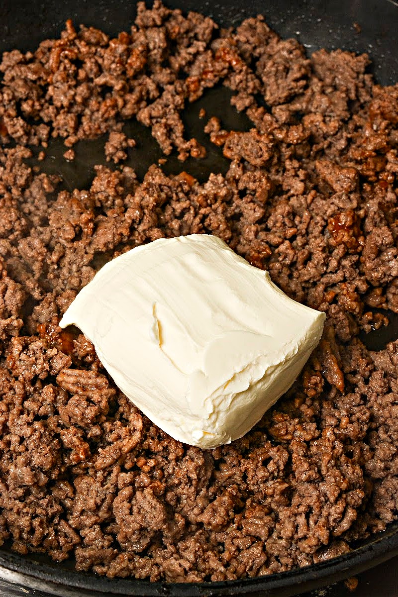 Adding cream cheese to the ground beef