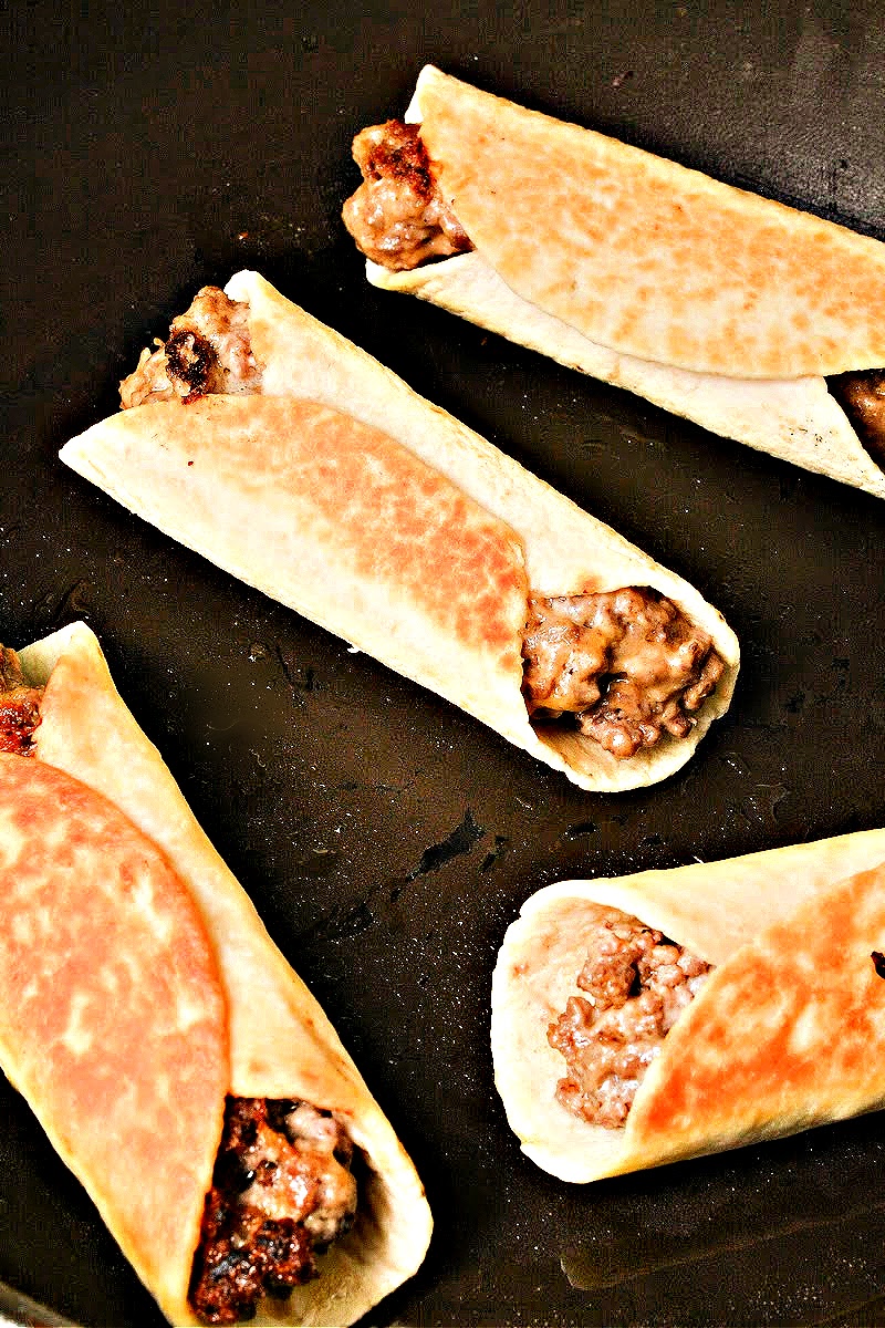 Keto Cheesy Beef Roll Ups in a skillet